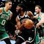 Brooklyn Nets? DeMarre Carroll (9) is defended by Boston Celtics? Jayson Tatum (0) and Gordon Hayward during the first half of an NBA basketball game Monday, Jan. 14, 2019, in New York. (AP Photo/Frank Franklin II)